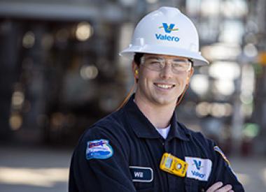 Smiling employee portrait in refinery