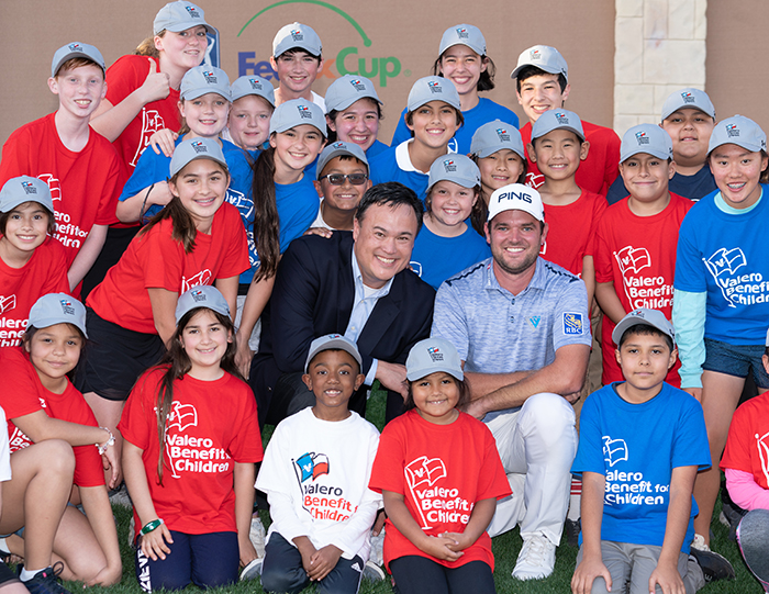 Eric Honeyman and Corey Conners with kids at Valero Benefit for Children