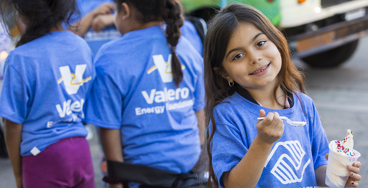 Girl eating ice cream and Boys and Girls Club event