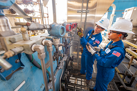 Two female Valero refinery employees