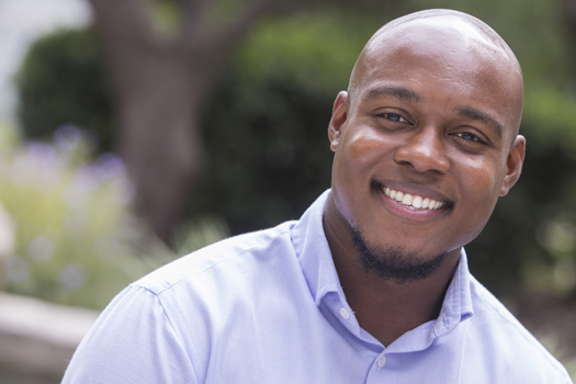 Young professional smiling at camera