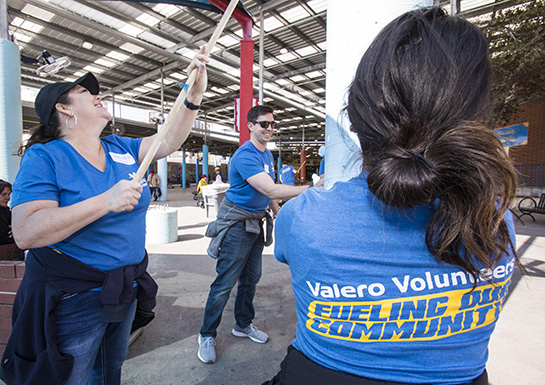 Valero Volunteers smile as they work on a volunteer project.