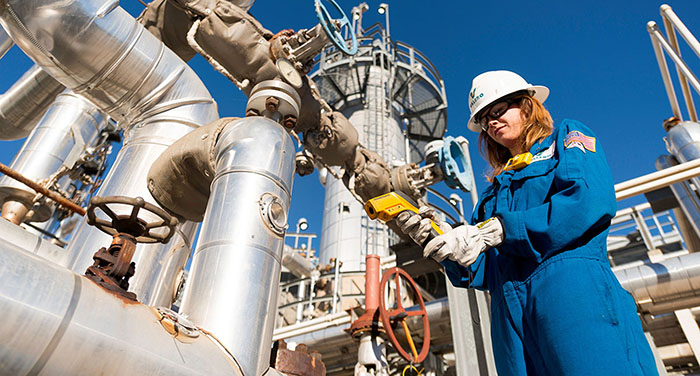 Operator looking down at equipment