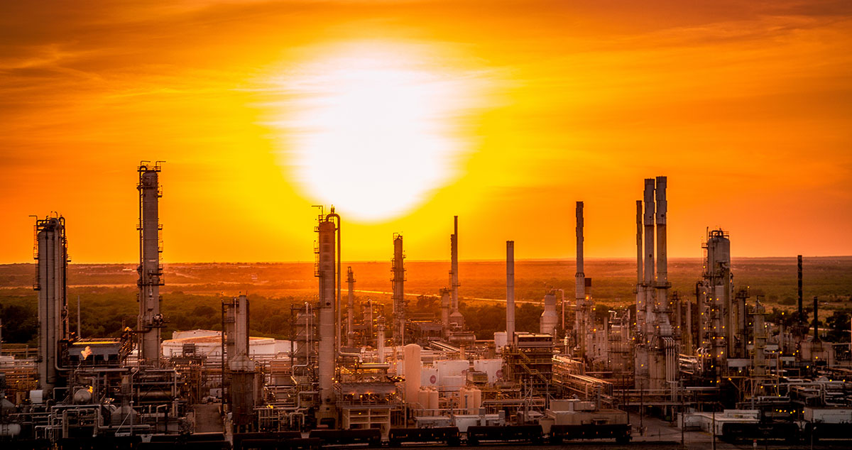 Refinery landscape silhouette image at sunset