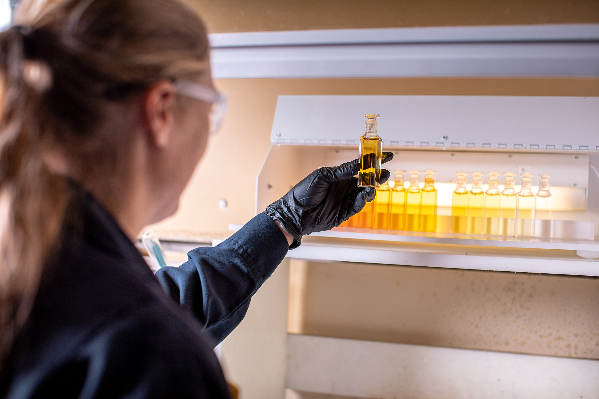 Woman in lab holding a test tube