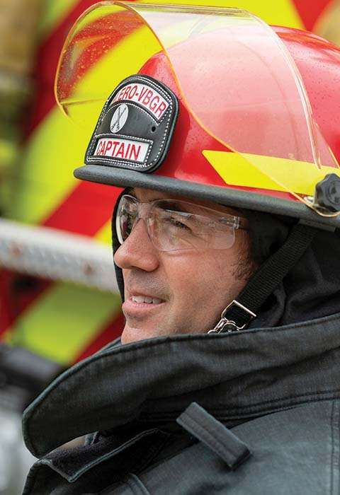 A Valero employee is clad in firefighting gear.