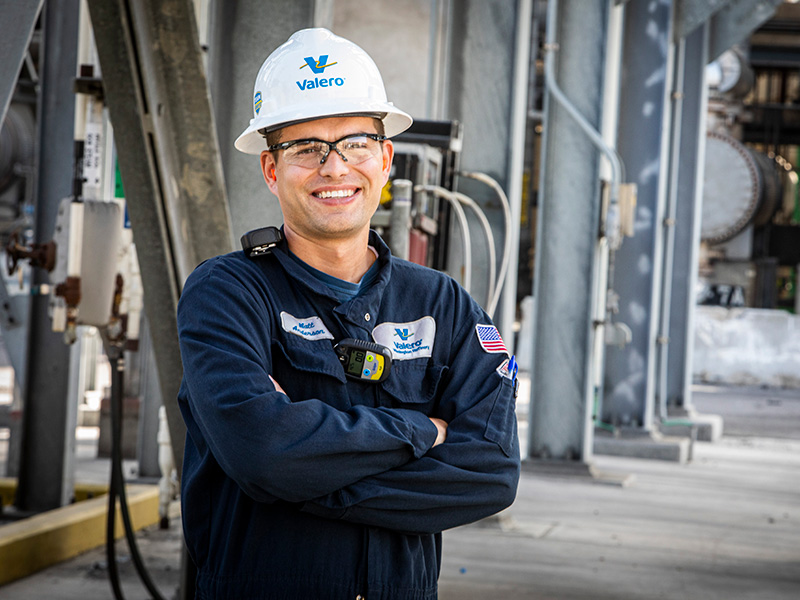 Field employee posed in refinery.