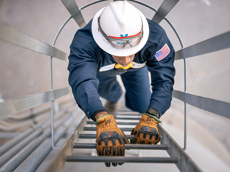 Employee climbing ladder