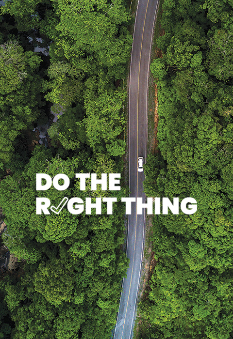 Aerial view of a white car driving on a road in a forest. Text reads: Do the right thing.