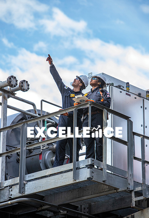 Two Valero employees inspect equipment at a refinery. Text reads: Excellence.