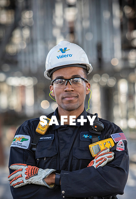 A Valero employee stands in a refinery. Text reads: Safety.