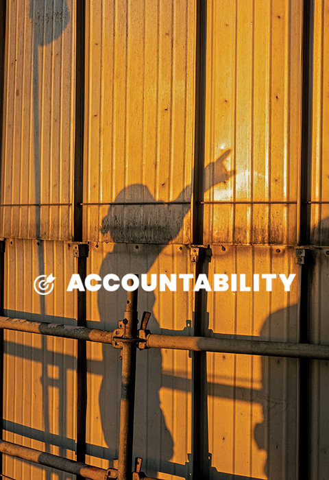 A silhouette of a Valero employee is cast on a wall. Text reads: Accountability.