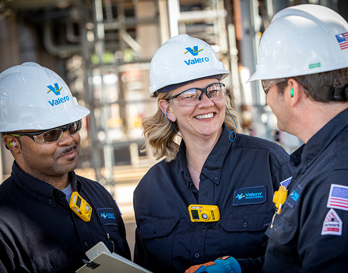 Three Valero employees stand together at the Memphis refinery.