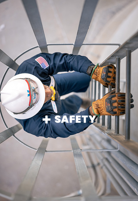 A Valero employee climbs a ladder. Text within the image reads "SAFETY."