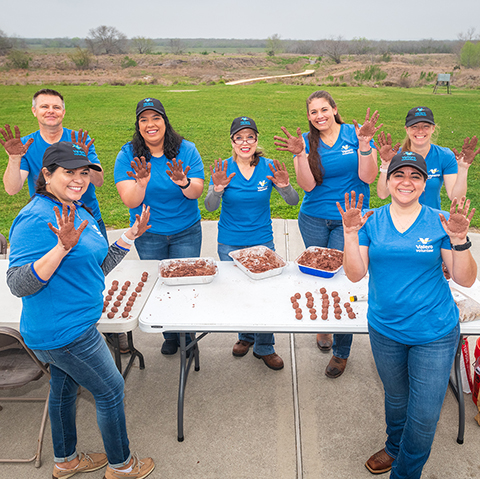 Valero volunteers prepare tree seeds for planting