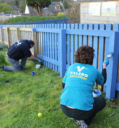 Valero Pembroke volunteers paint fence