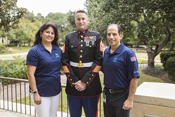 Valero employeeswith Marine in uniform