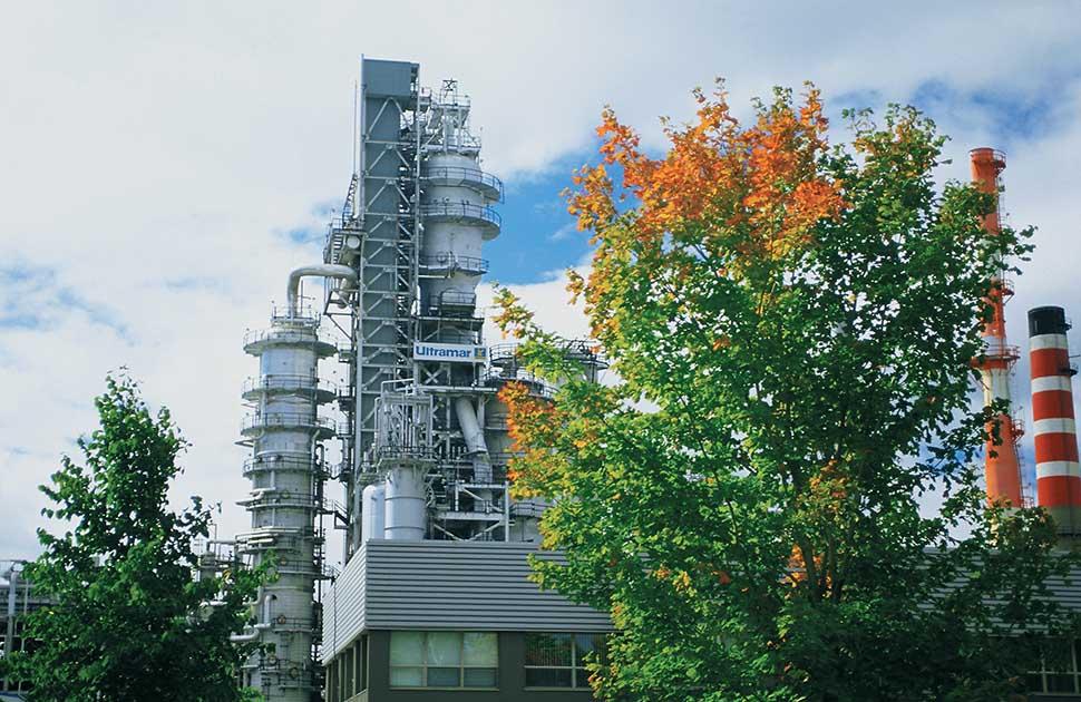 jean gaulin refinery with trees