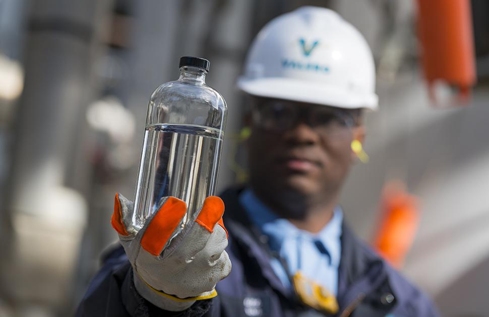 Valero employee inspecting fuel product