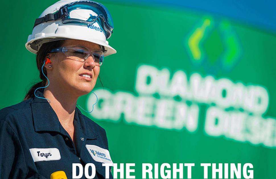 Operator standing in front of a Diamond Green Diesel tank