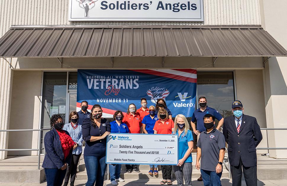 Photo of Valero employees outside of "Soldiers' Angels" with a donation