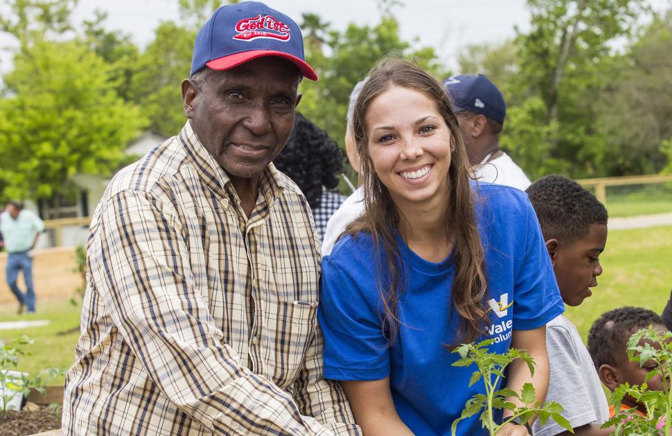 Volunteers planting with community members