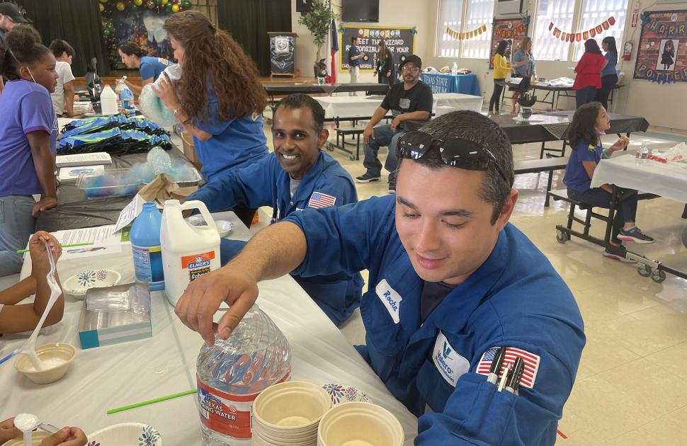 Valero volunteers doing crafts with children at volunteer event