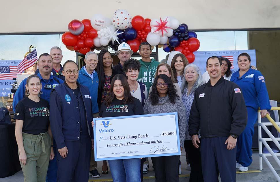 Veterans at Valero's Wilmington refinery pose with a check donation of $45,000 to U.S. Vets - Long Beach.