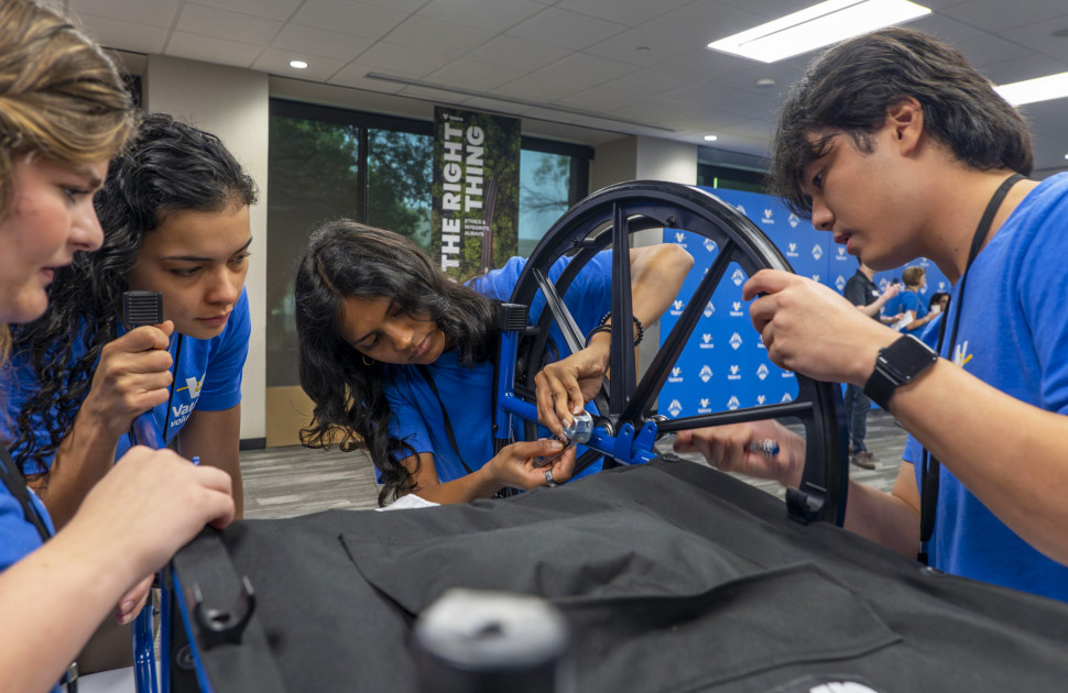 Students assembling a wheelchair during Freshman Engineering Summit