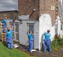 Valero volunteers paint house