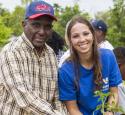 Volunteers planting with community members