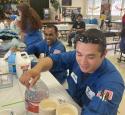 Valero volunteers doing crafts with children at volunteer event