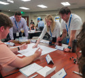 Interns collaborating at Symposium