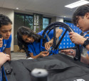 Students assembling a wheelchair during Freshman Engineering Summit