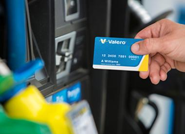 Customer using Valero credit card at gas pump