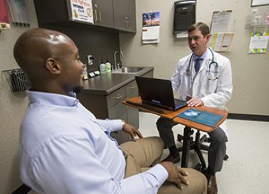 Valero employee in Wellness Center with Doctor